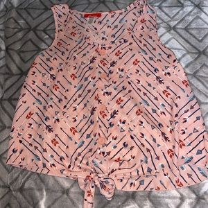 Pink top with arrow design and fake buttons